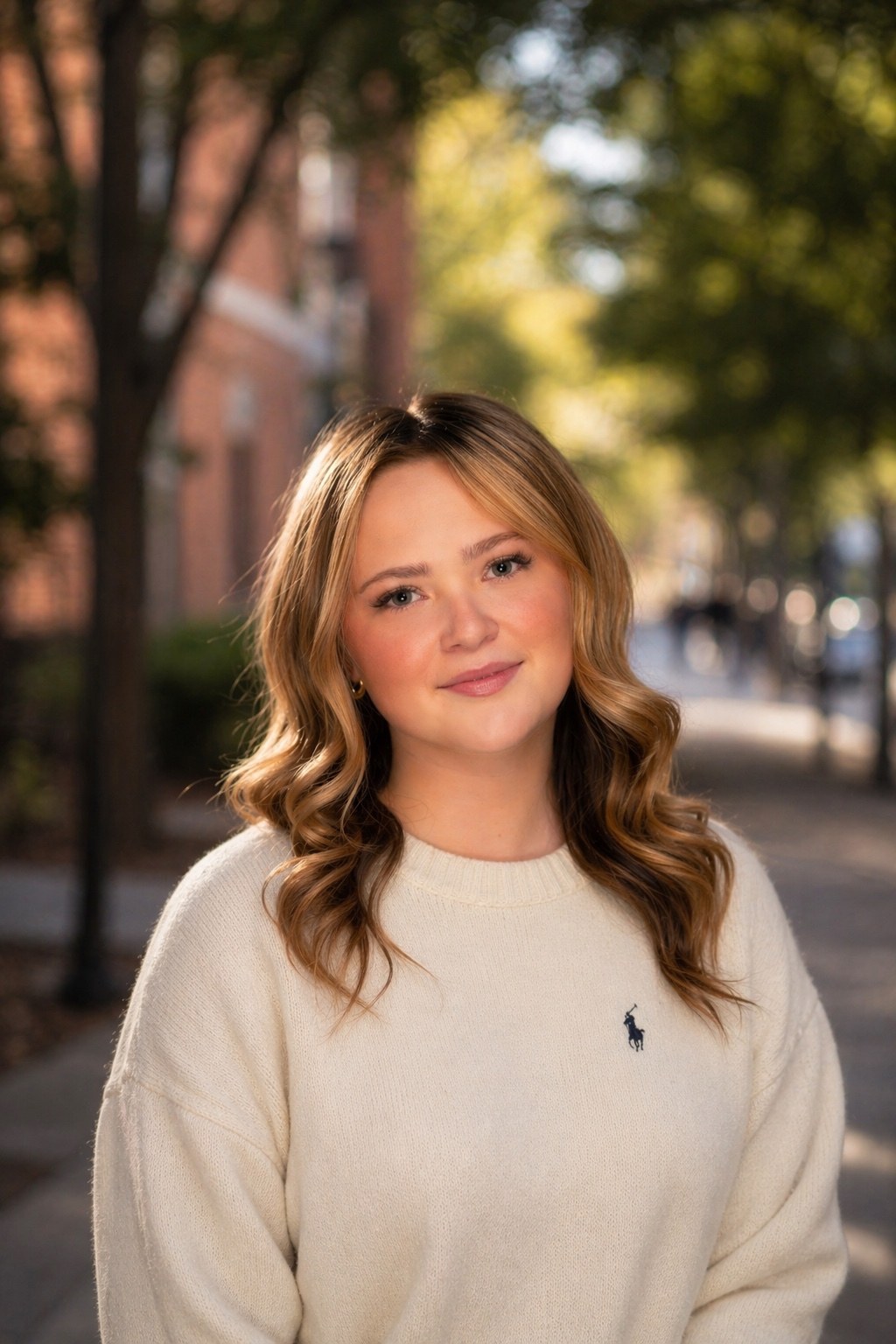 Emma Fuller wearing a white Ralph Lauren sweatshirt